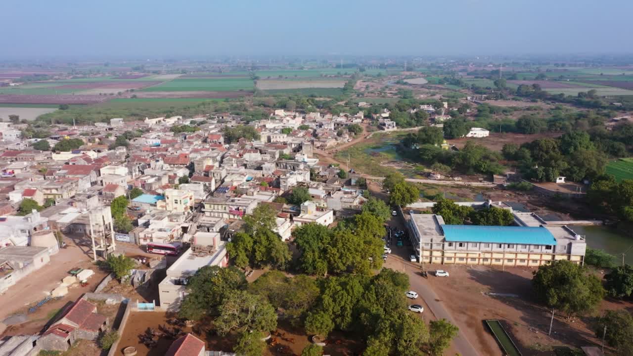 rural landscape with farm house, wheat fields and meadows. Harvest time