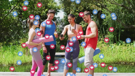animation of social media icons over group of diverse fit people using smartphone in the park