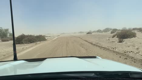 Driving-through-a-sandstorm-in-outback-desert,-northern-South-Australia