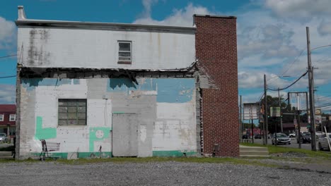 abandoned store buildings on the corner of busy street