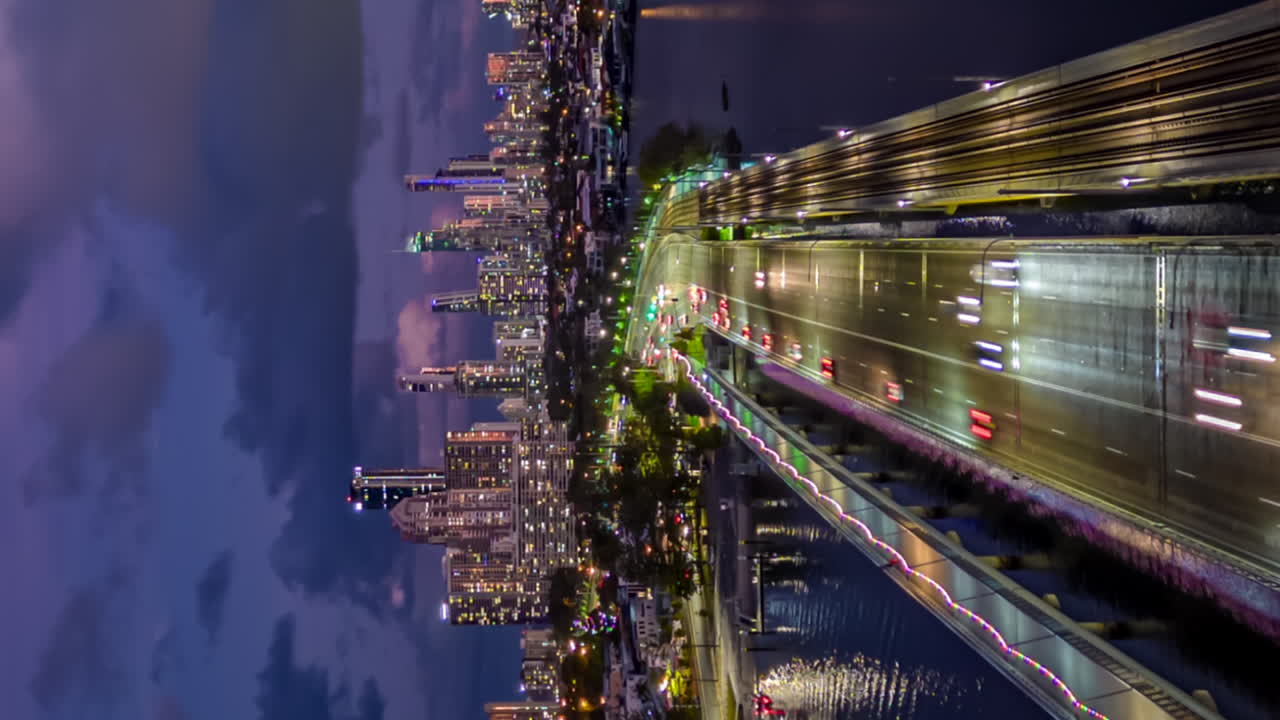 Vertical hyperlapse of colorful sunset above Surfer's paradise's skyline, Gold Coast of Australia