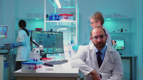 Portrait-of-experienced-scientist-man-looking-tired-at-camera