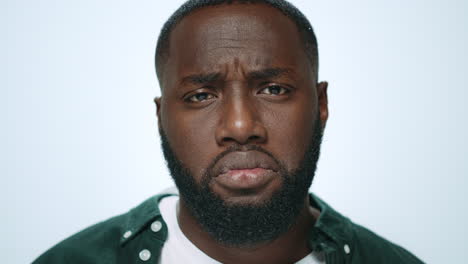 Portrait-of-offended-african-american-man-looking-at-camera-in-studio.