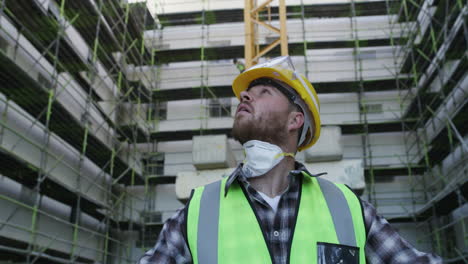 a young man going over building plans