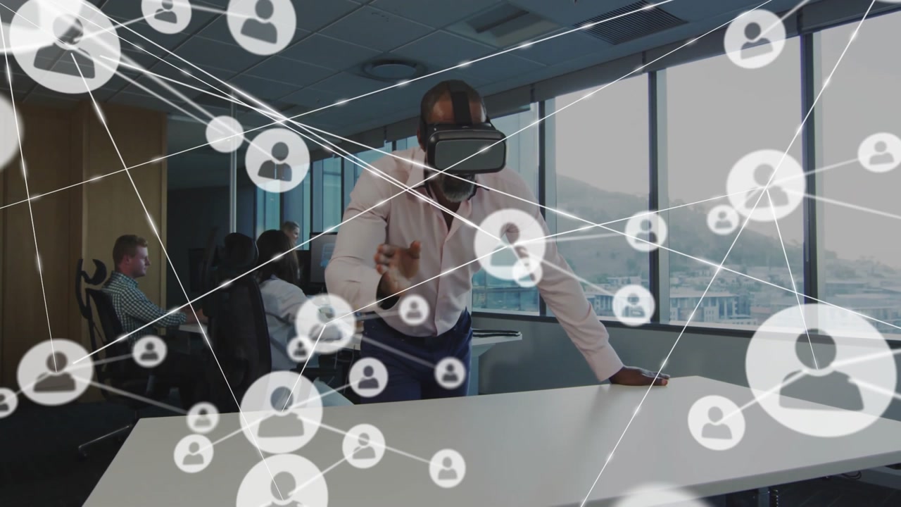 Office tech lead wearing VR headset tapping profile icons and mapping network connections