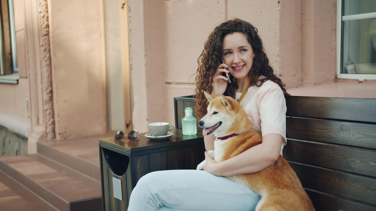 Woman with Shiba Inu Dog in a Cafe