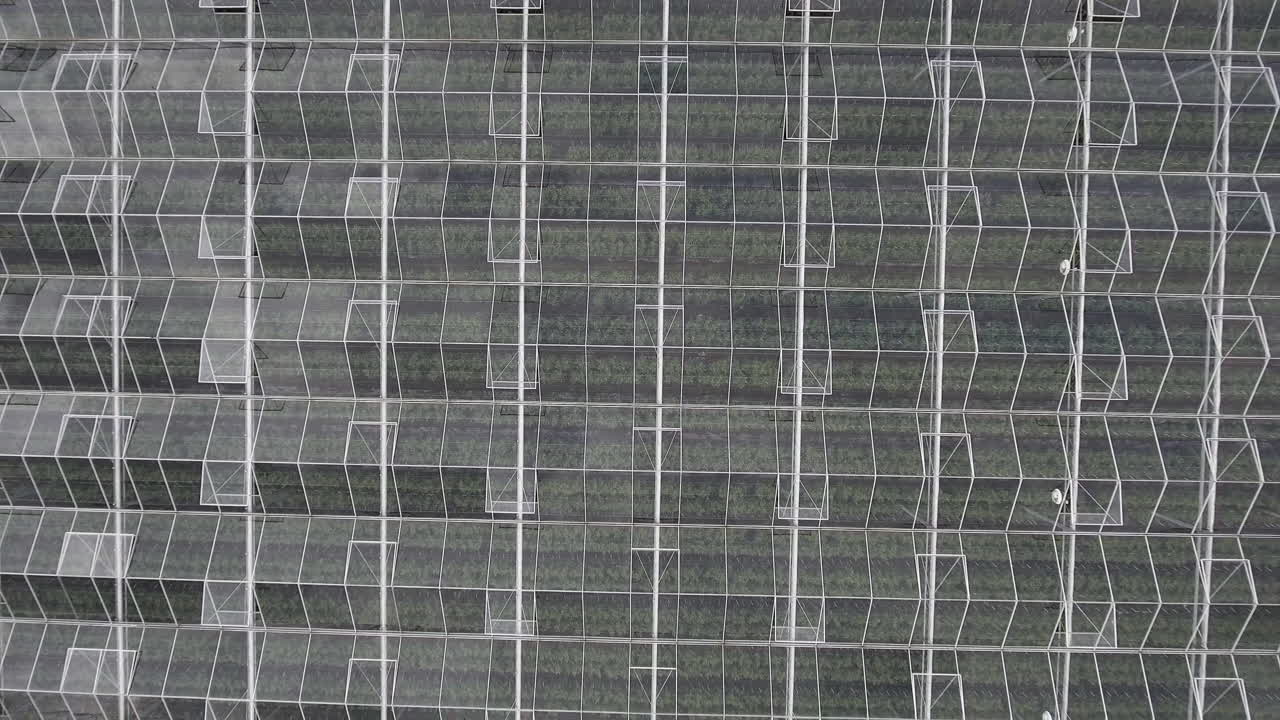 4K Aerial Top Drone Shot of Glass Greenhouse Flying Upwards