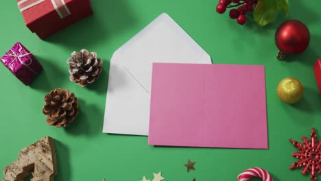 Christmas-decorations-with-envelopes-and-copy-space-on-green-background