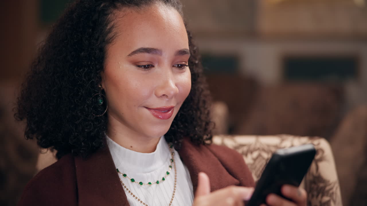 Woman using her phone indoors