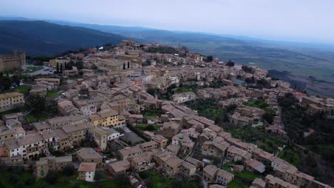 aerial view of medieval city montalcino in italy, historic fortress, old town reveal
