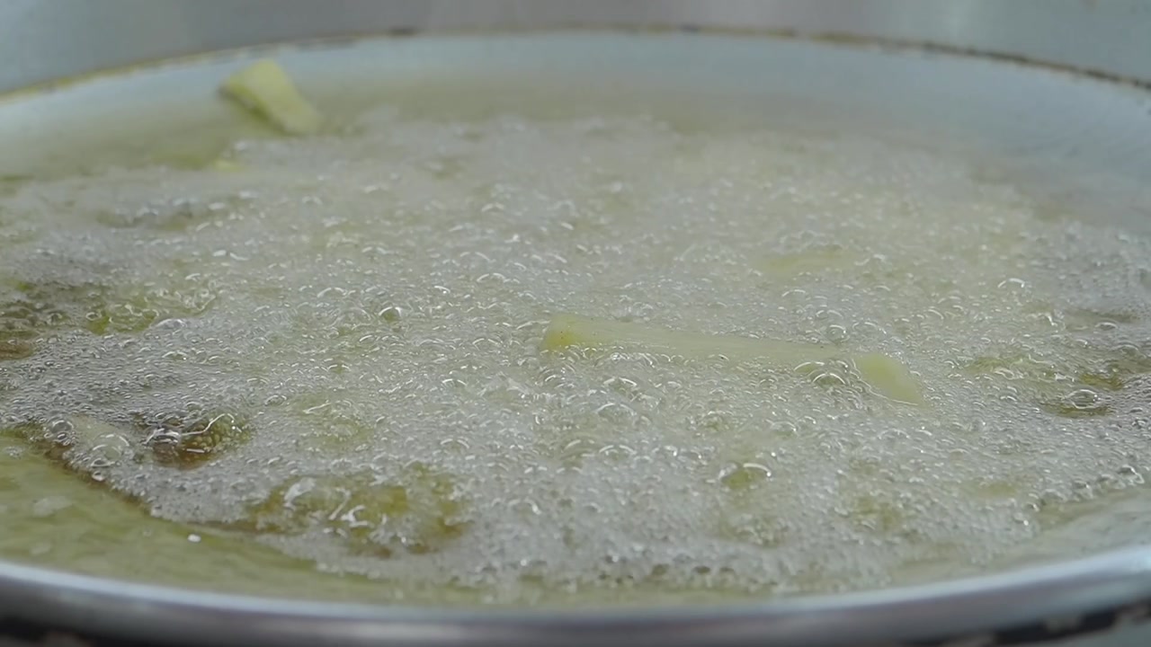 French Fries Frying in Hot Oil in a Pan