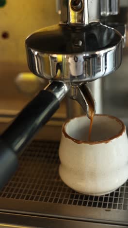 espresso being poured into a cup