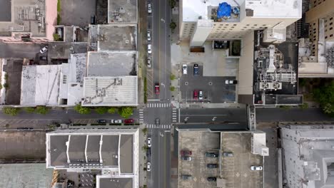 Overhead-drone-view-of-intersection-in-downtown-Mobile,-Alabama-with-stable-video