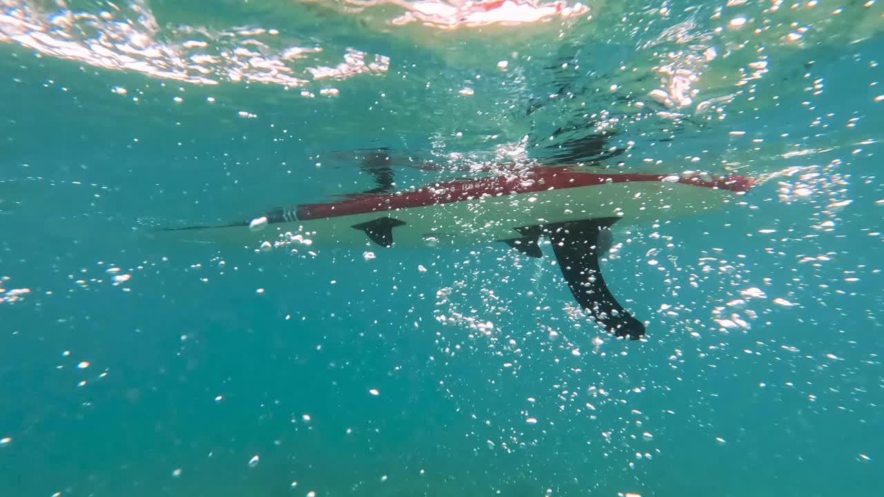 Underwater View of Paddleboard Floating Above in Clear Adriatic Sea – Tranquil Summer Scene near Krk Island, Croatia with Sunlight Filtering Through Water and Peaceful Coastal Atmosphere