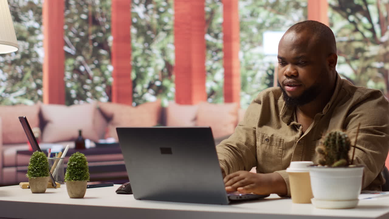 Freelancer using his laptop to manage business analytics and financial planning