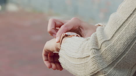 hand, watch and time with a woman checking