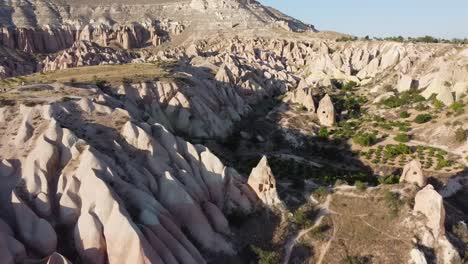 Aerial-drone-view-of-Red-Rose-valley,-Cappadocia,-Turkey-at-Golden-hour-time,-before-sunset