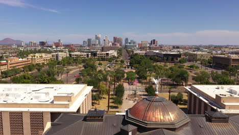 view of phoenix arizona skyline with winged victory statue in foreground