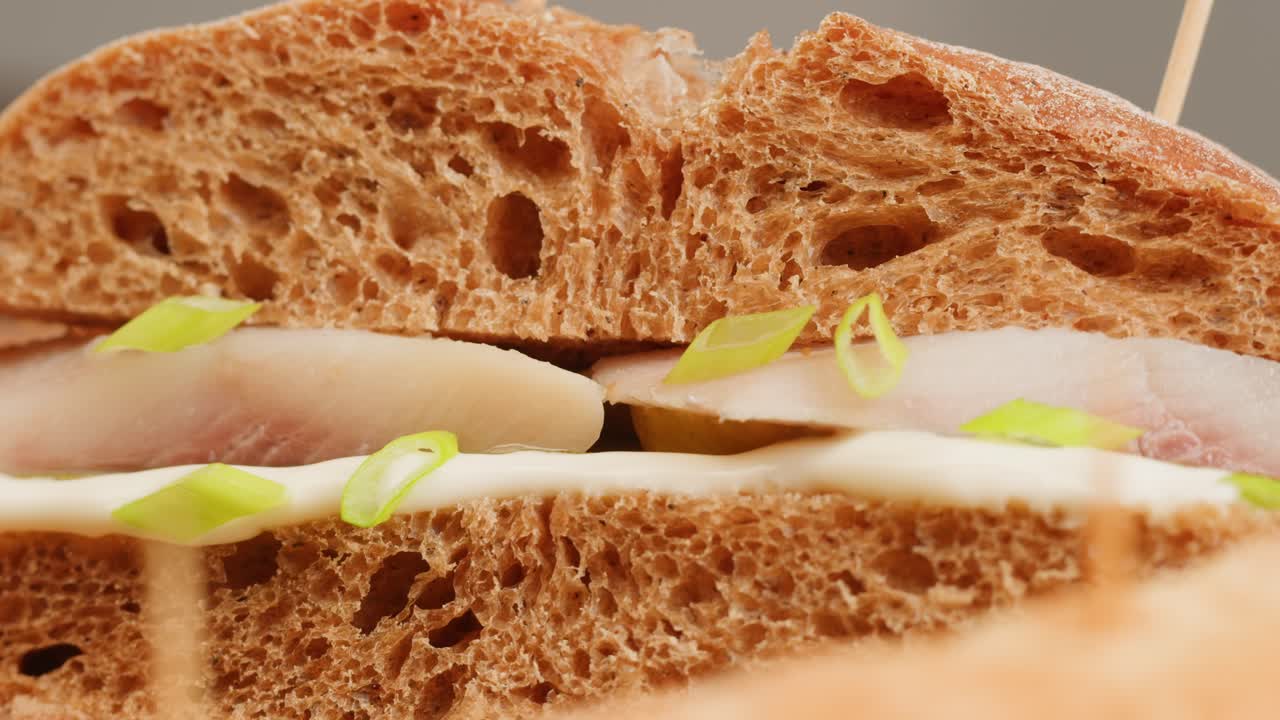 Close-up of a delicious fish sandwich on whole-grain bread
