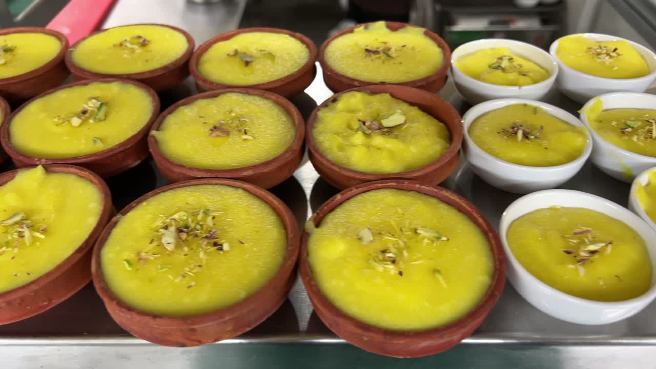 Milk made firni in earthen pot at display in Kolkata, India.