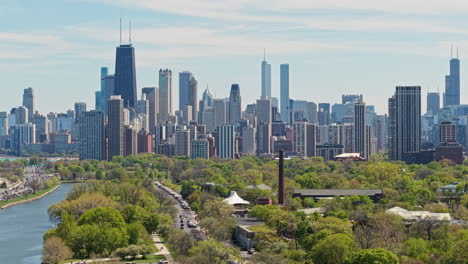 chicago cityscape skyline from north and lincoln park, drone shot of central buildings and skyscrapers in mist