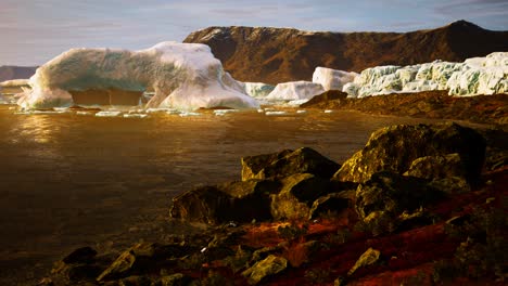 Antarctic-icebergs-near-rocky-beach
