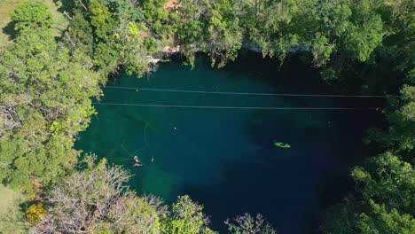 Unrecognizable-people-swimming-in-blue-waters-of-Dudu-lagoon,-Cabrera-in-Dominican-Republic