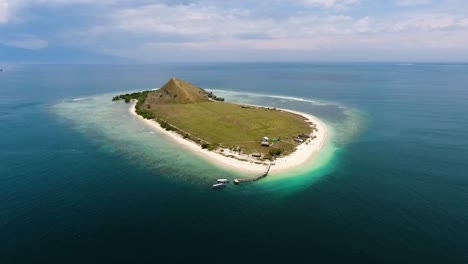 aerial footage of tropical paradise island isolated in the clear pristine ocean water kenawa island located on alas strait, between the islands of lombok and sumbawa