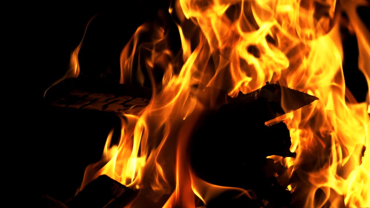Bonfire. Slow motion. Real fire flame on a black background