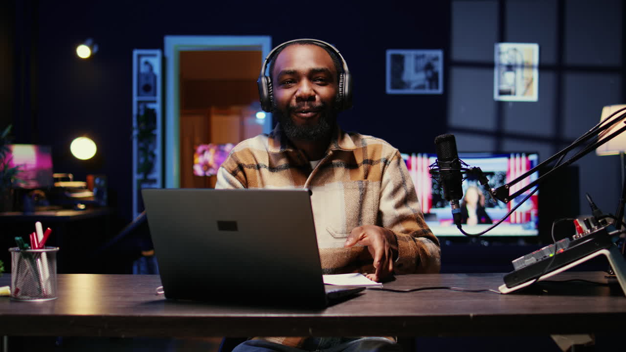 Vlogger putting headphones on, talking with social media followers