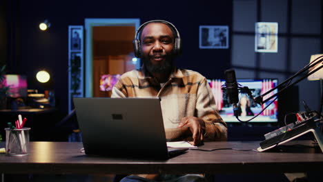 vlogger putting headphones on, talking with social media followers