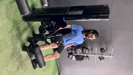 Latin-man-with-beard-and-long-hair-in-extension-chair-equipment