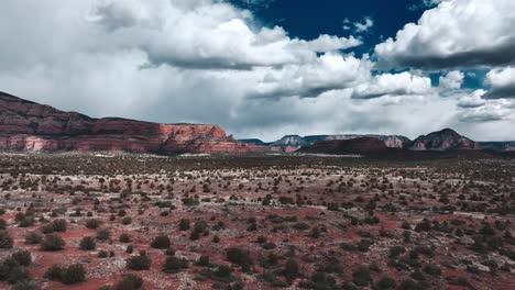 arizona desert landscape against cloudy sky - pullback