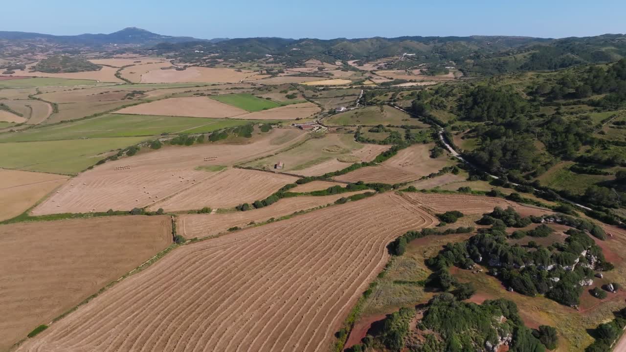 Rural countryside agriculture field rolling hills Menorca island Spain nature, aerial drone