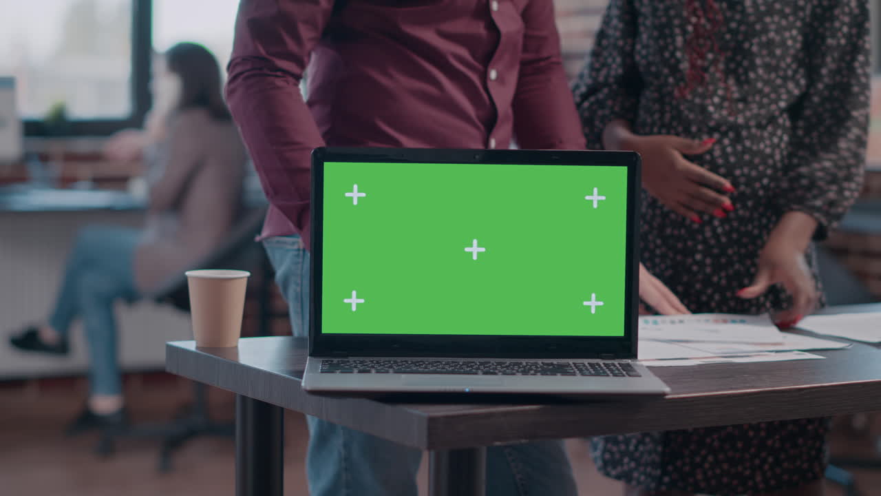 Close up of horizontal green screen on laptop at office