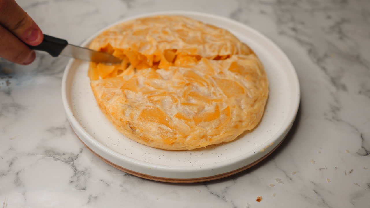 Cutting into a Delicious Spanish Tortilla