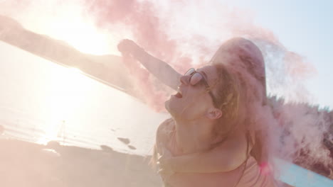 loving couples playing with pink smoke