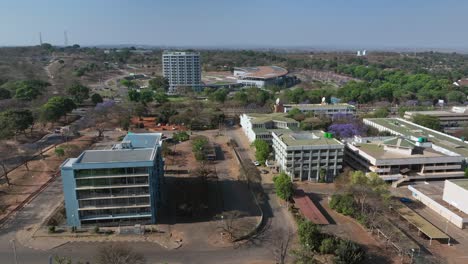 aerial drone view of lilongwe city centre with president hotel at umodzi park in lilongwe, malawi.