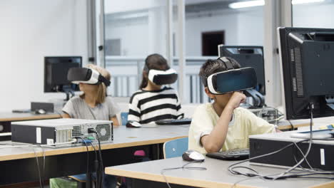 multiethnic kids having fun using virtual reality headset