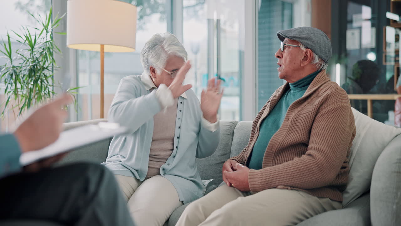 Elderly couple having a serious conversation