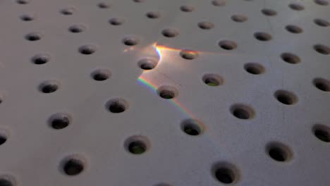 closeup of moving sunny bunny atop dot pattern perforated surface