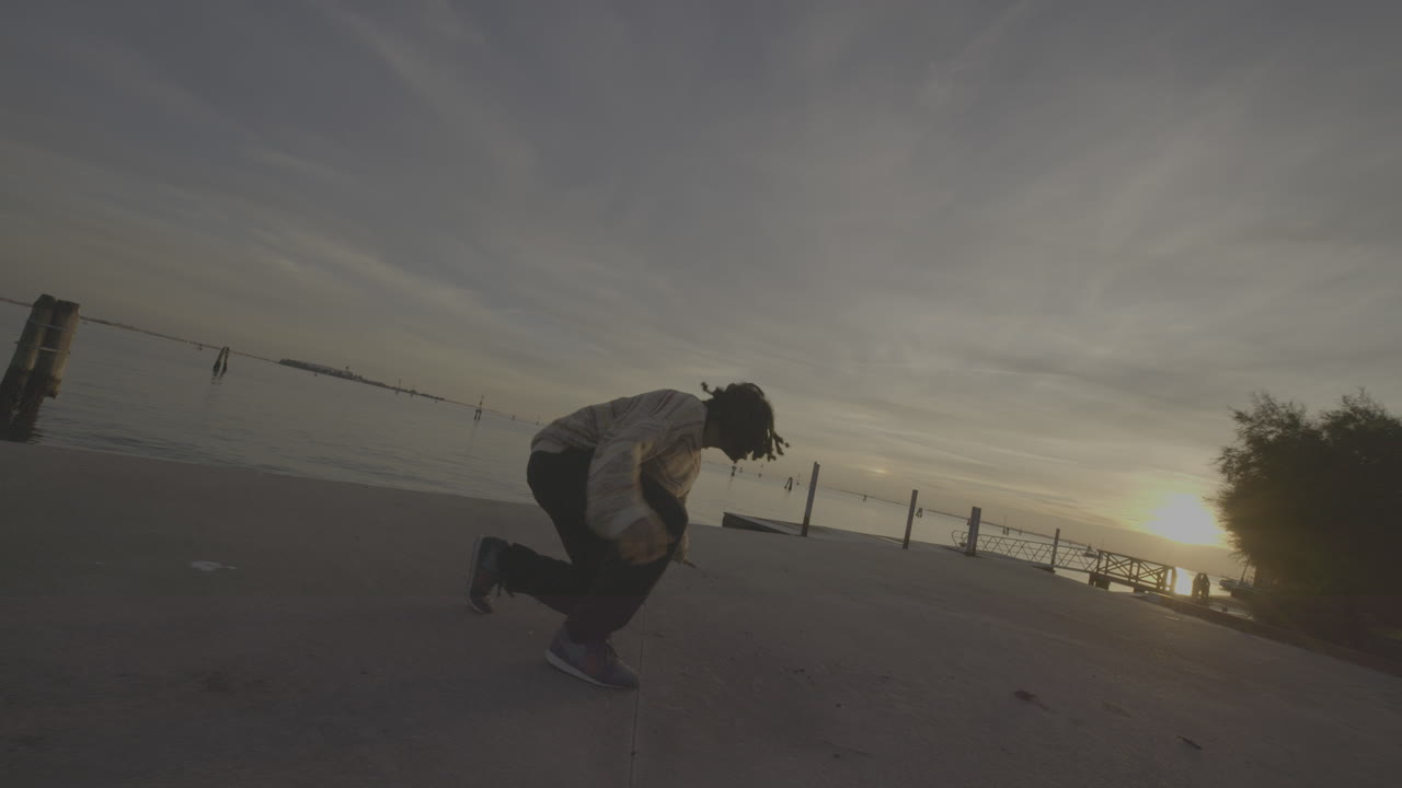 Breakdancing by the Venetian Lagoon at Sunset