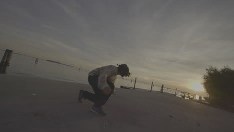 breakdancing by the venetian lagoon at sunset