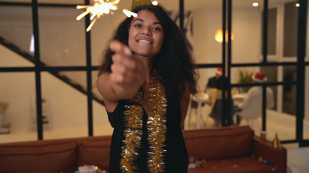 Beautiful Black Woman Holding A Sparkler At New Year's Eve Party