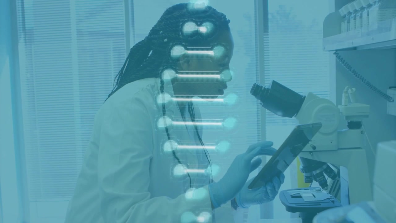 Animation of dna strand over african american female scientist working in lab
