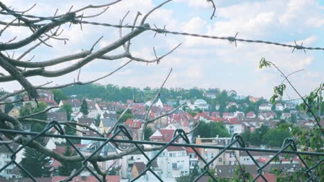 german-small-town-on-the-hillside-behind-barbed-wire-and-fence