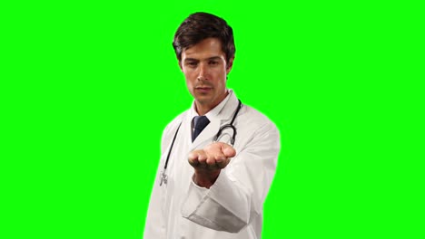 Front-view-of-a-doctor-holding-his-hand-for-a-copy-space-with-green-screen