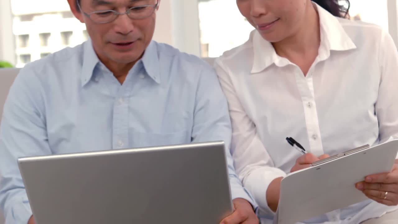 Couple looking at computer together