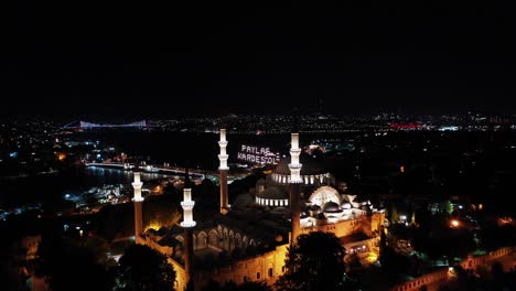 aerial view of suleymaniye mosque. there says "share, be brother"