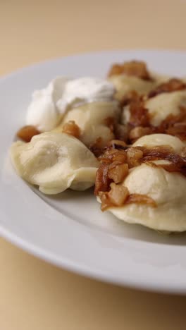 pierogi with sour cream and caramelized onions